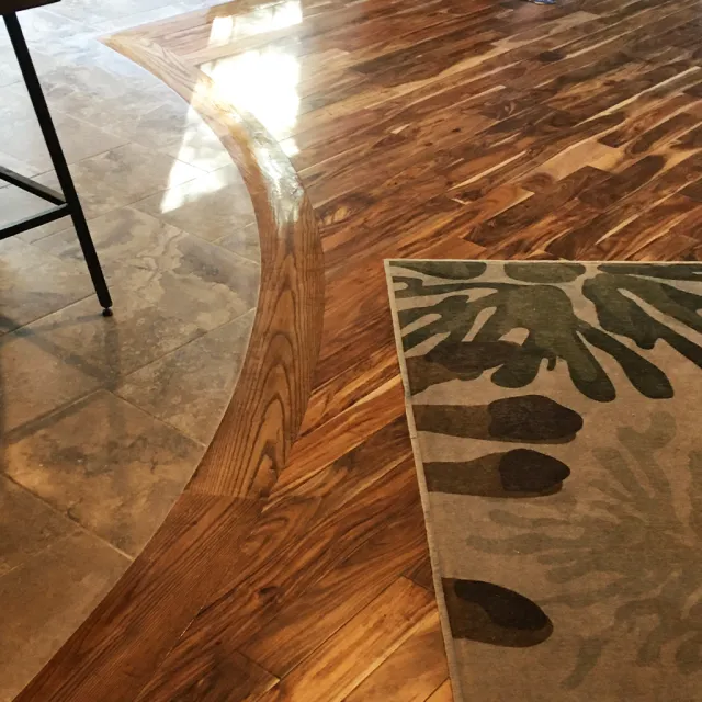 Flooring installation by Hartman Construction Corp including unique transition from tile to hardwood flooring.