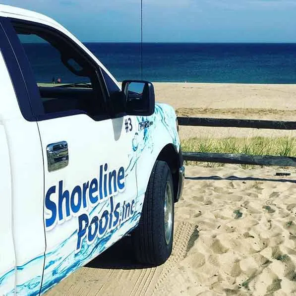 Shoreline Pools truck at teh beach on Cape Cod