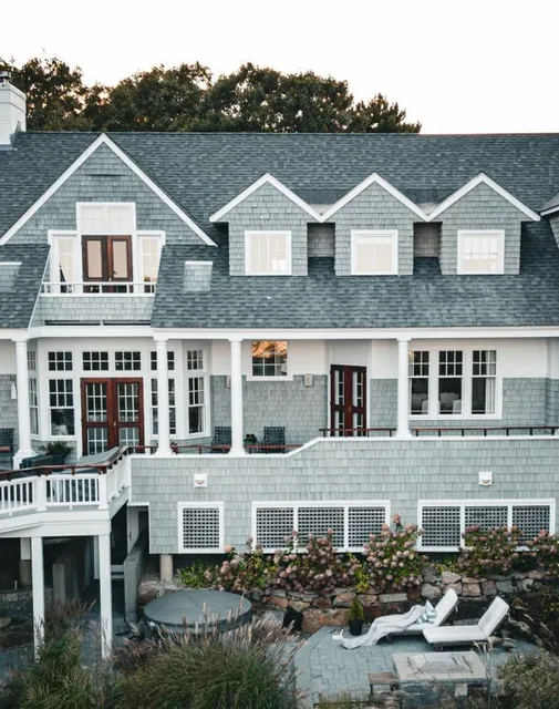Professional painted home with grey siding and white trim