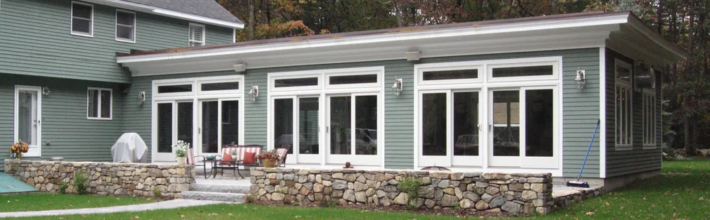 Sunroom addition — exterior with stone terrace