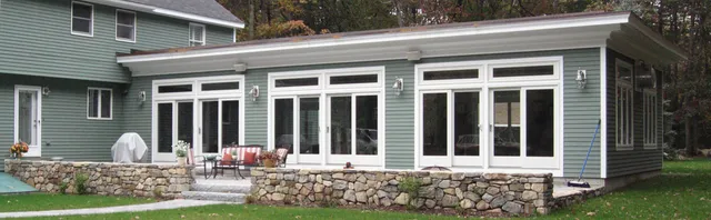 Sunroom addition — exterior with stone terrace