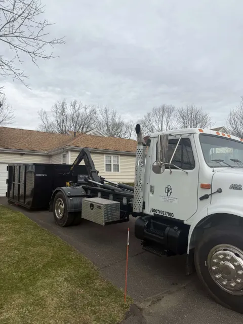 Roll-off dumpster in use for a local Connecticut residential or contractor job
