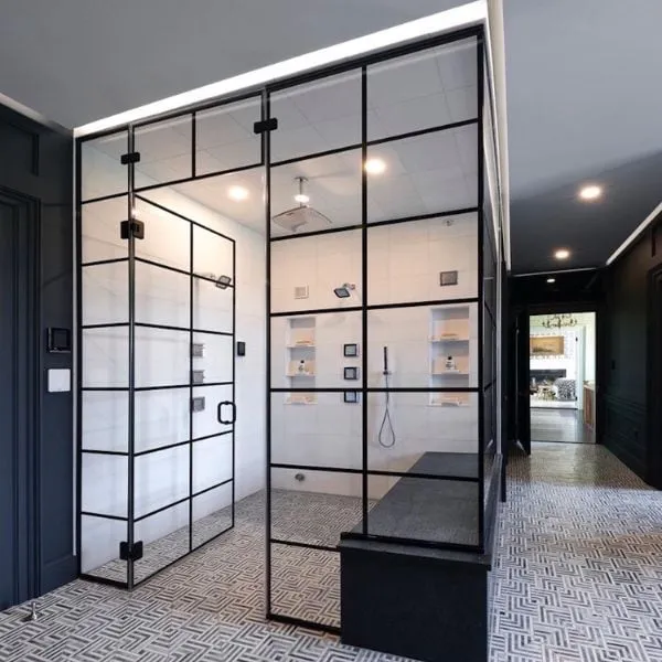 High-end bathroom remodel with rainfall showers, body jets, marble tile, custom glass, and heated tile floors in New Castle, NH