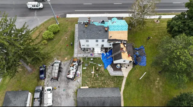 Aerial view of a completed roof replacement on a Connecticut home
