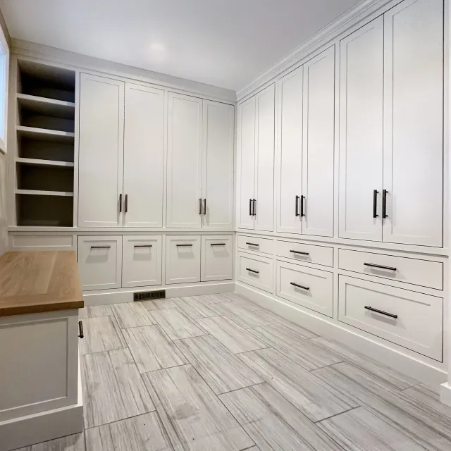 Custom mudroom built-in with bench seating, lockers, and integrated storage in North Reading, Massachusetts.