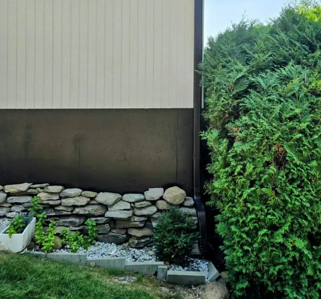 Sleek Black Seamless Gutter Installation in Leominster, MA