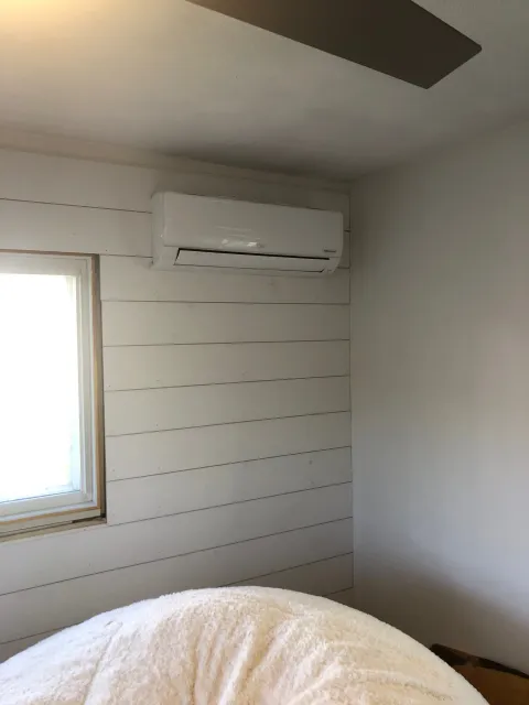 Ductless mini-split head installed in a bedroom