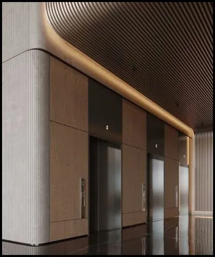 A photograph of a welcoming, warmly lit lobby space, showcasing three elevators. Between each elevator, there are stunning wood grain Architectural Panel Systems, adding a touch of natural elegance to the setting. This combination of modern technology and natural materials creates a harmonious and upscale atmosphere in the lobby.