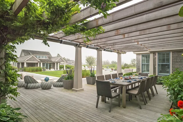 Wisteria-covered pergola and dining terrace