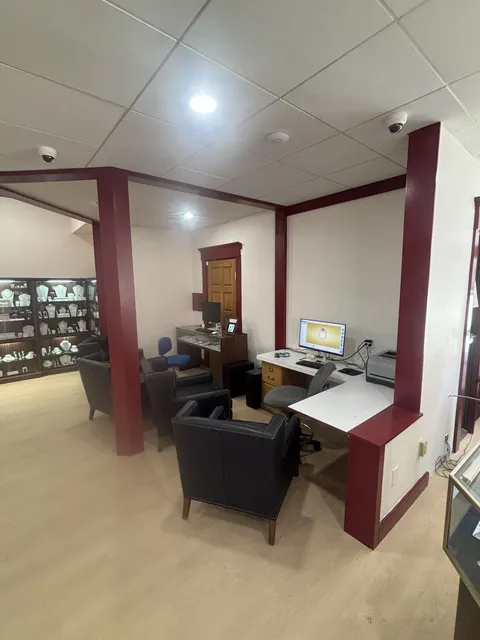 Consultation desk and seating under new recessed ceiling lights in the Concord jewelry store