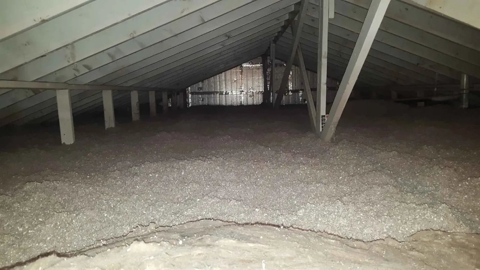 Attic insulation installed in Franklin Massachusetts home to improve energy efficiency and reduce heat loss.