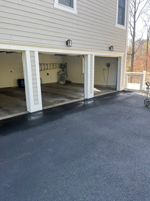 Finished three-car garage with open doors