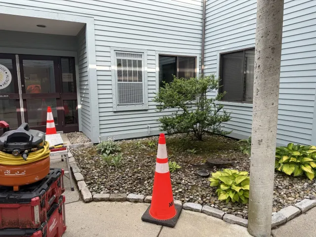 Exterior courtyard wall before selective demolition in Warwick Rhode Island