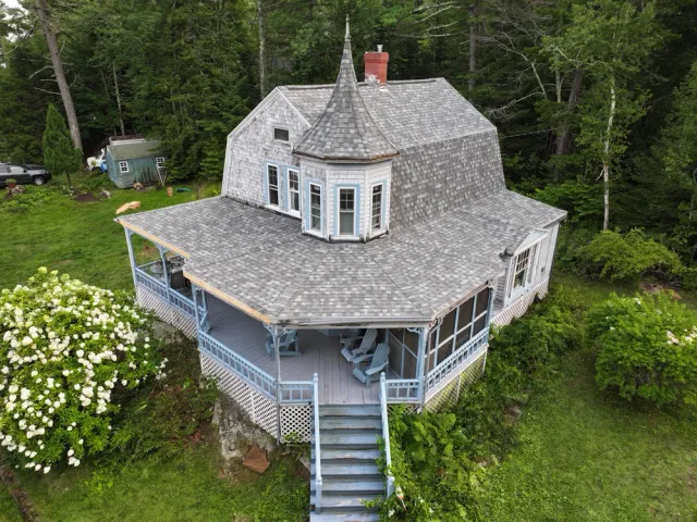 Historic house with wrap-around porch and turret