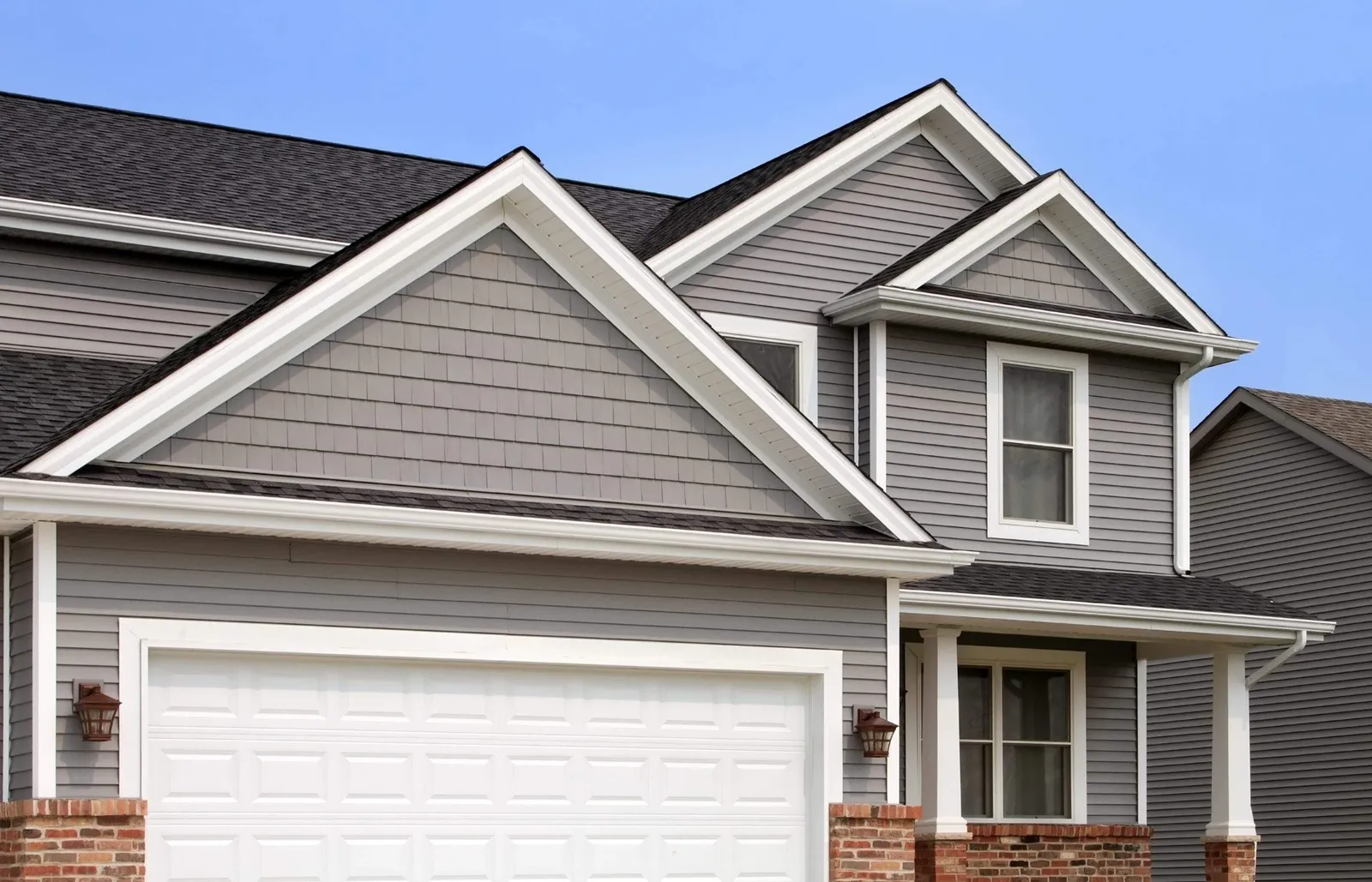 New home with vinyl siding gutters and roof in worcester ma