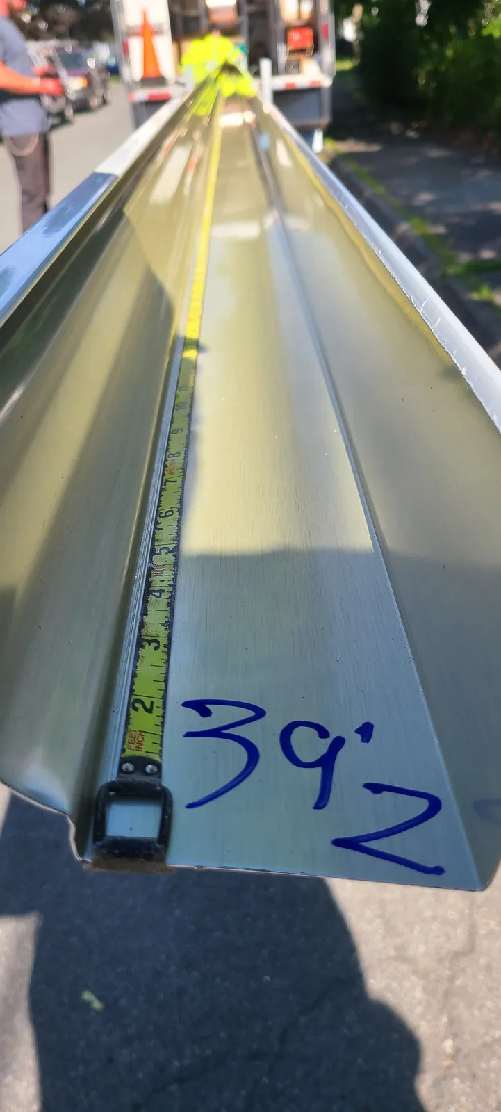 Seamless gutter being fabricated on site