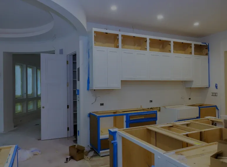 Cabinets being installed in kitchen