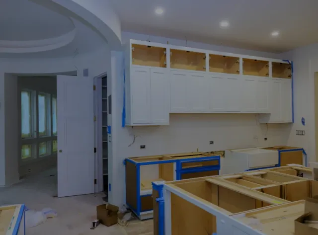 Cabinets being installed in kitchen