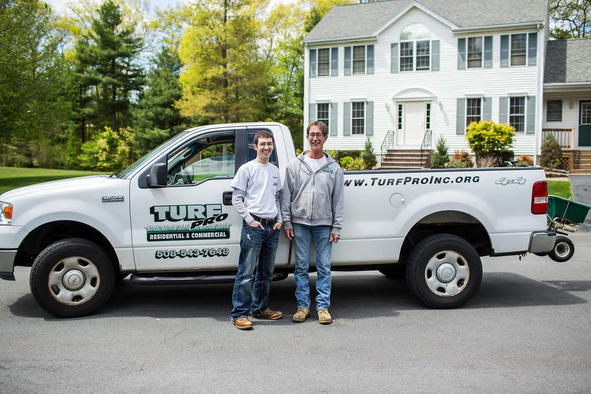 Turf Pro, Inc. family team in front of company truck