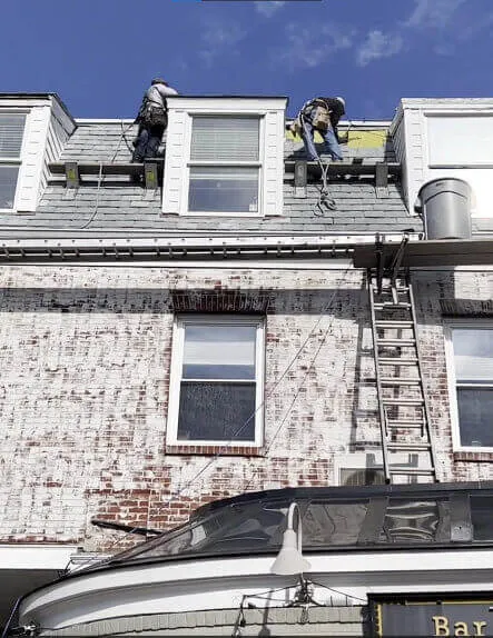 a man fixing a roof