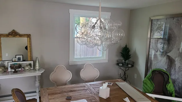Renovated dining room with new trim, lighting and finishes