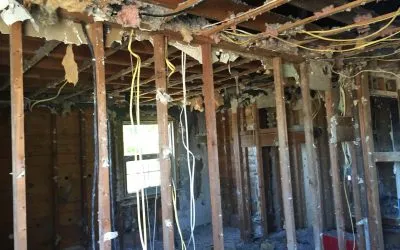 Damaged ceiling and wall structure illustrating disaster restoration services in Westport.