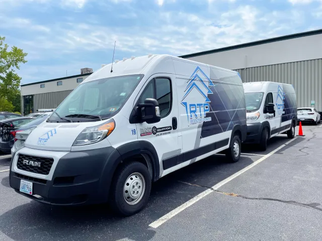 Rooftop Power's branded service vans at the Warwick, RI headquarters