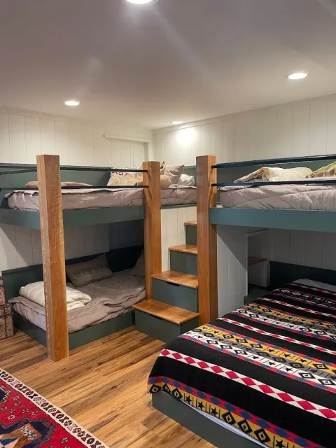 Painting and staining custom built bunkbeds in New London, NH.