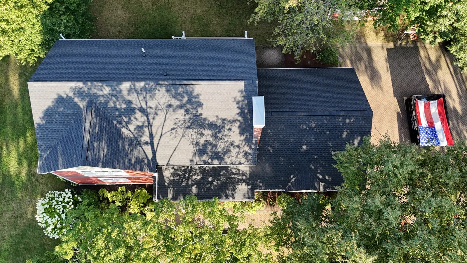 Protecting flowers in Reading MA📍 Rybo Roof Replacement is the only way. #roofing #wecare #homeimprovement #dumpster