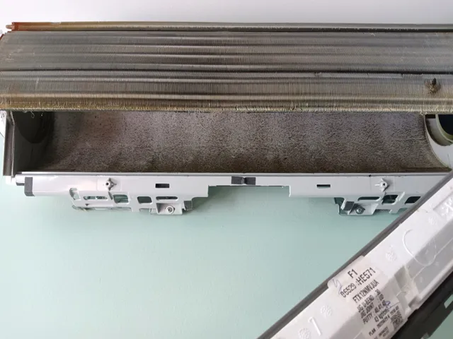 Mini-split coils and drain pan exposed for chemical wash in Hartford VT