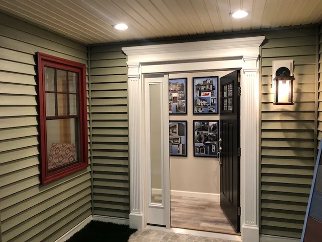 Showroom entry door and siding vignette
