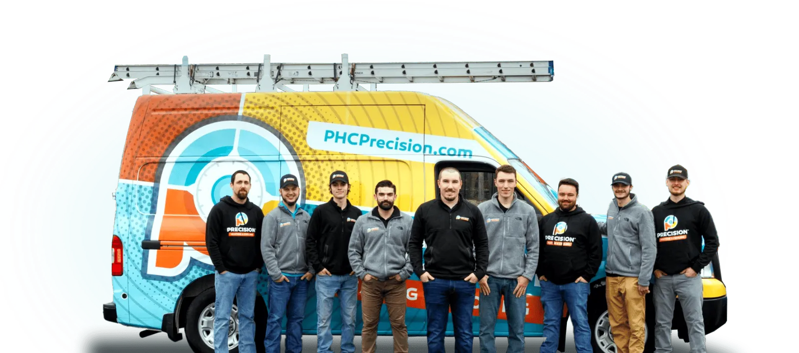 Precision Home Services team photo, taken in front of one of their HVAC service vehicles.