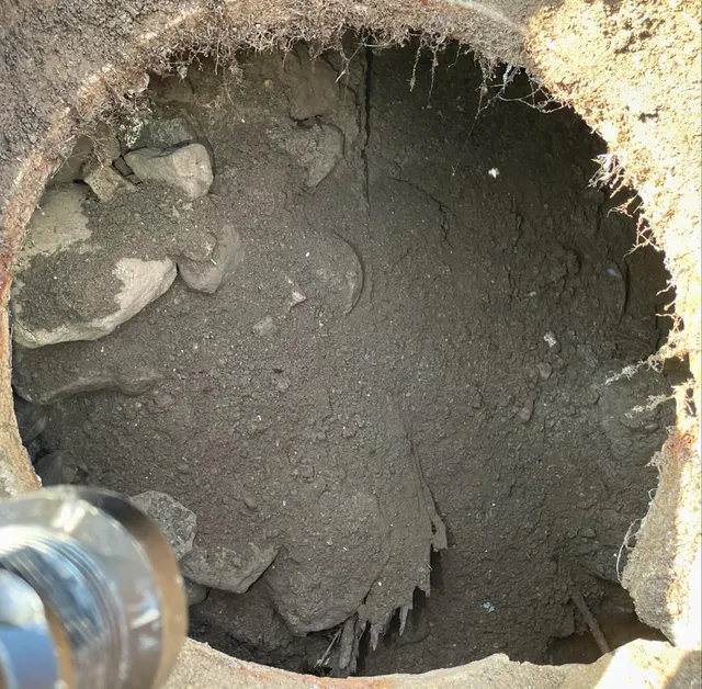 What we don’t like to see when opening a septic tank… The wall of this 1970s tank has completely caved in. Good reminder not to drive or have heavy equipment over a septic tank. Also infrequent maintenance can increase sewer gas build up that can deteriorate the concrete.