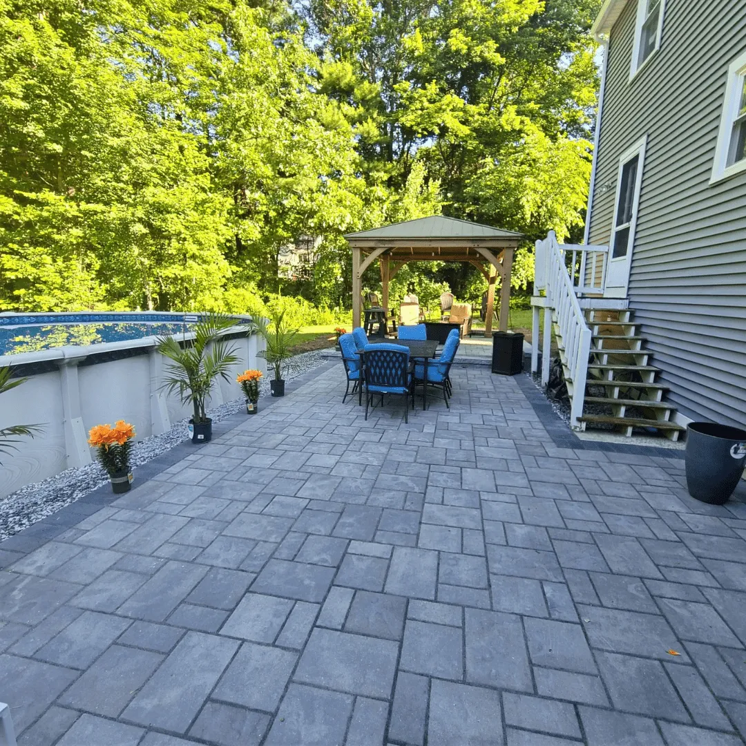 Patio with concrete floor by Modena NH - hardscapes bedford nh