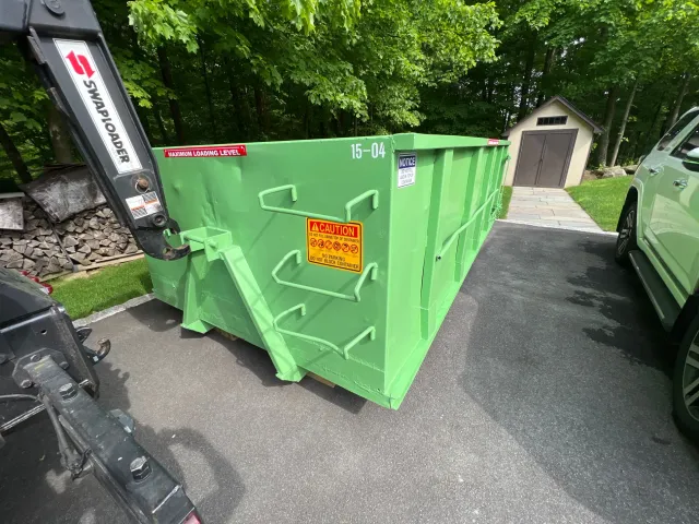 15-yard dumpster on residential driveway