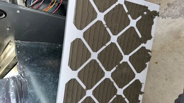 HVAC furnace air filter completely clogged with dust before replacement
