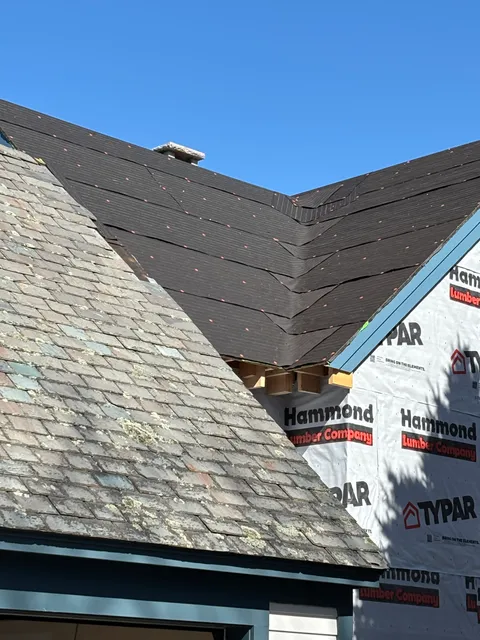 New slate installation with underlayment visible