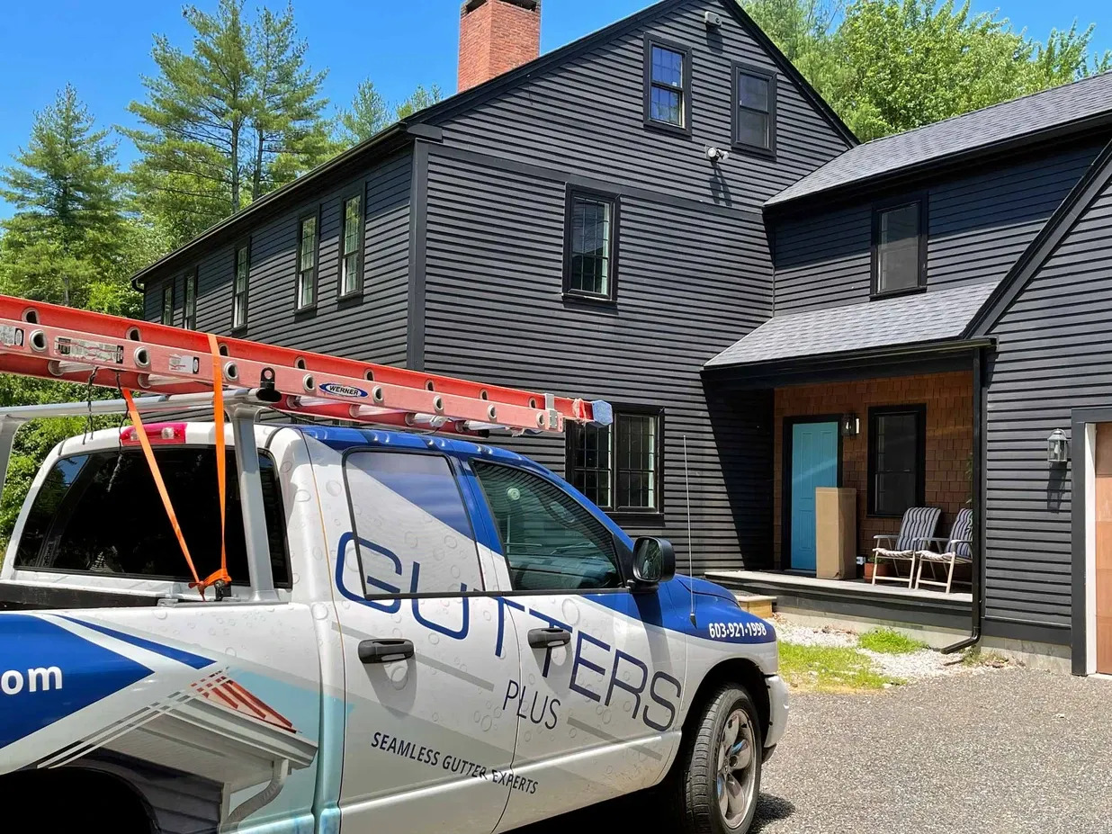 Gutters Plus truck in front of home