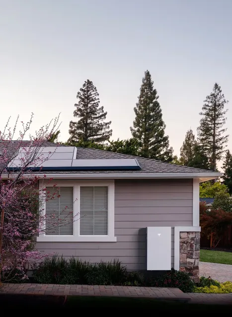 A home with solar panels installed on the roof, harnessing solar energy for sustainable power.