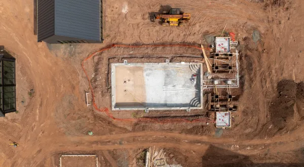 Sweeney, drone image of top of worksite surrounded by dirt, technology