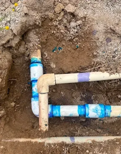 New underground water service piping in an open trench