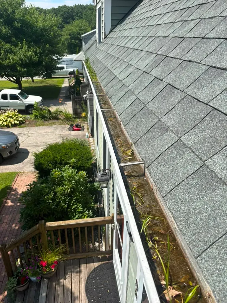 Before: old gutter on the same house