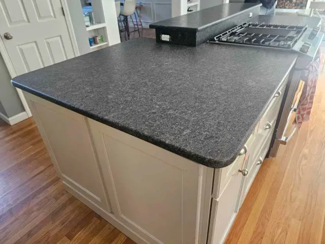 Silver Pearl leathered granite island countertop fabricated and installed by Precision Granite Works in Exeter, NH