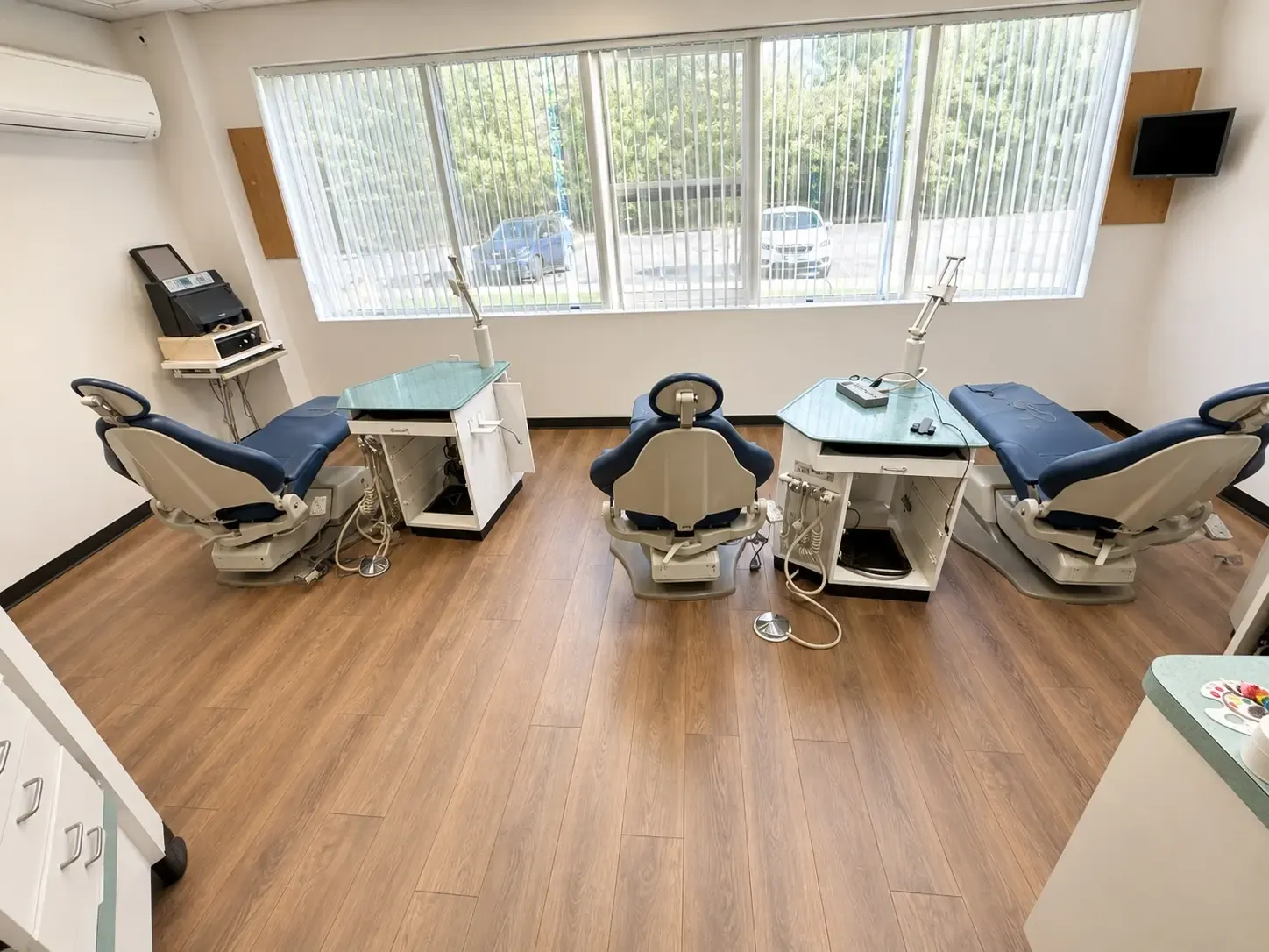 Continuous luxury vinyl plank flooring through a kitchen and living area
