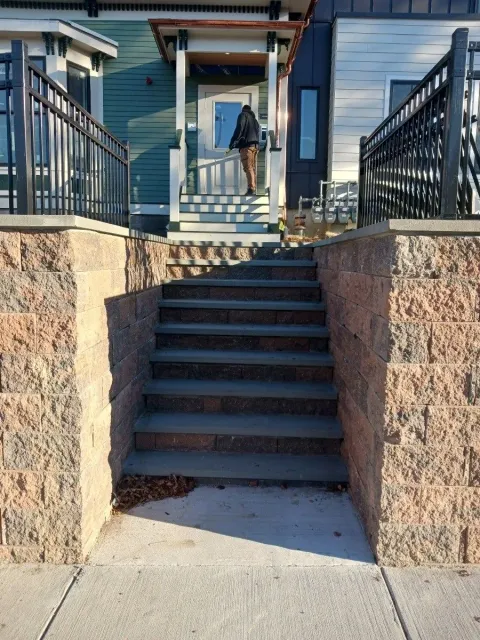 a set of stairs leading up to the front door of a house