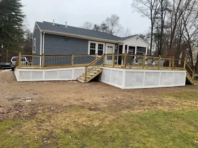 Custom pressure-treated deck mahogany hand rails built by SJ Wilson Construction in Hanson, MA