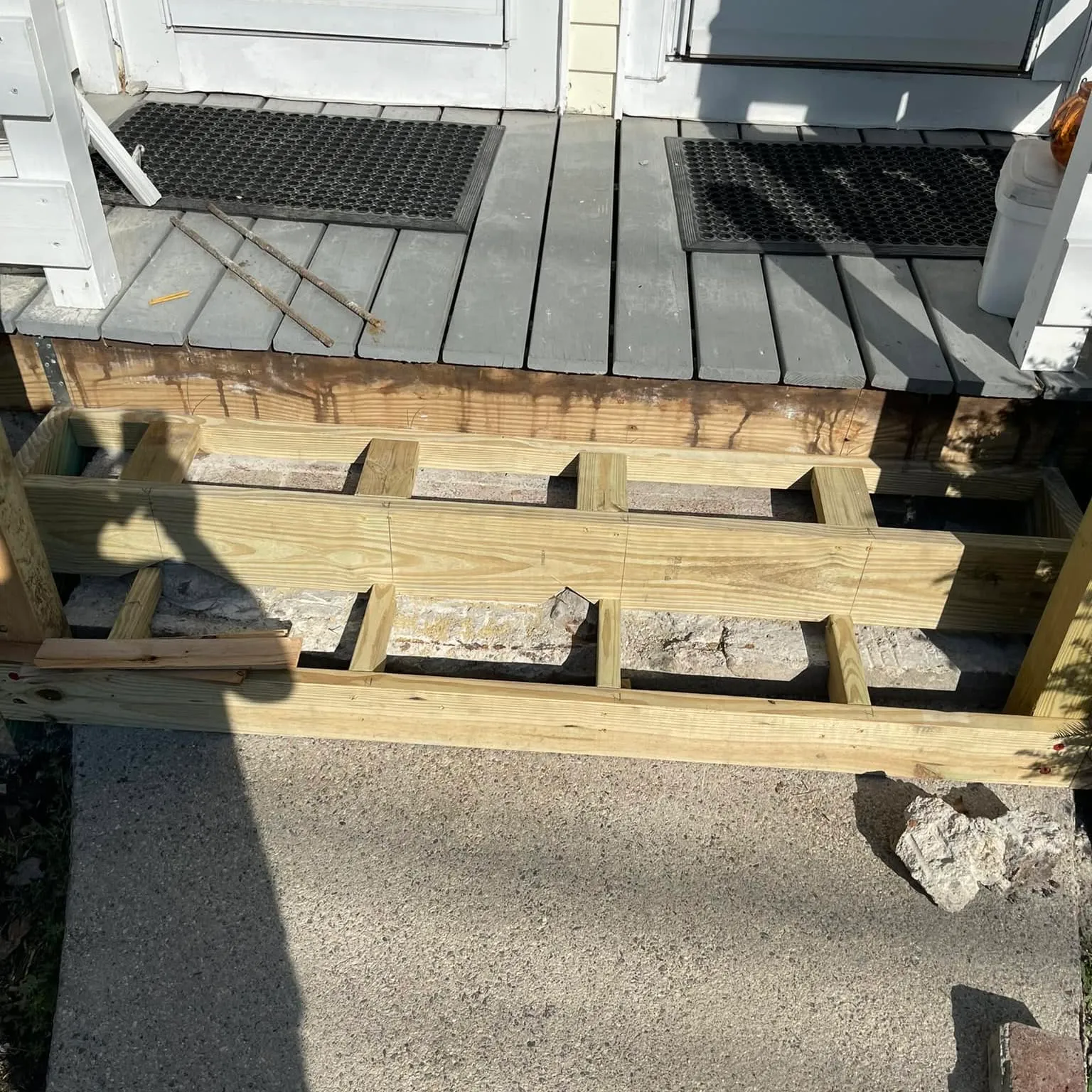 New stair framing set against composite decking