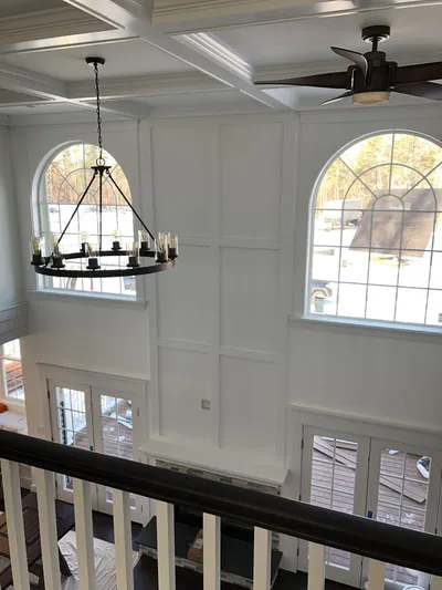 Interior entry way with custom trim work and high ceilings