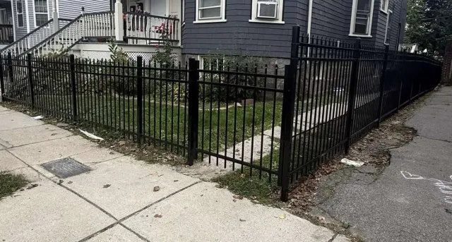 Black aluminum fence installation by The Right Fence