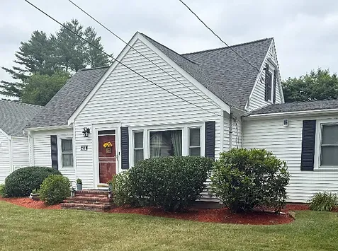 Fresh mulch installation around garden beds in Cumberland, RI